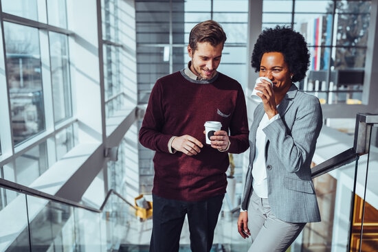 happy employees talking in the office