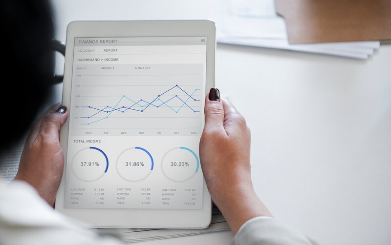 Businessman analysing finances on a tablet dashboard