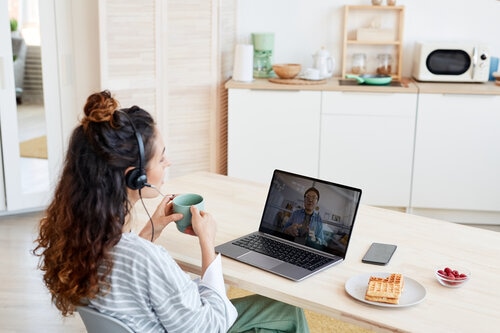 Coworkers talking through video call at home