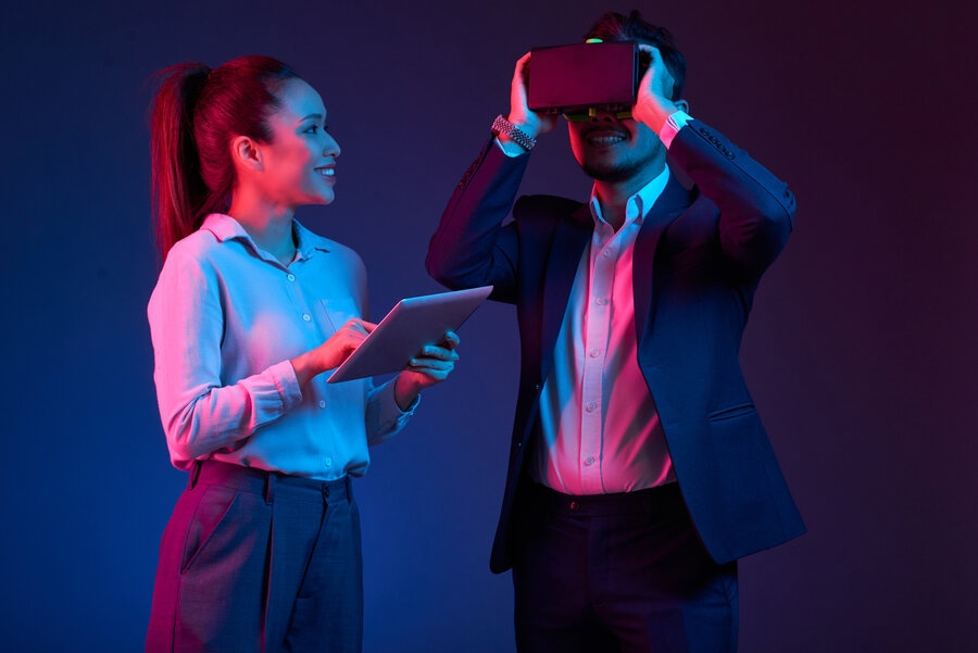 Businesspeople testing a VR headset