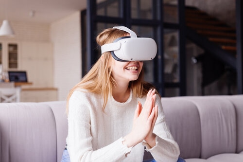 Woman working while wearing a VR headset