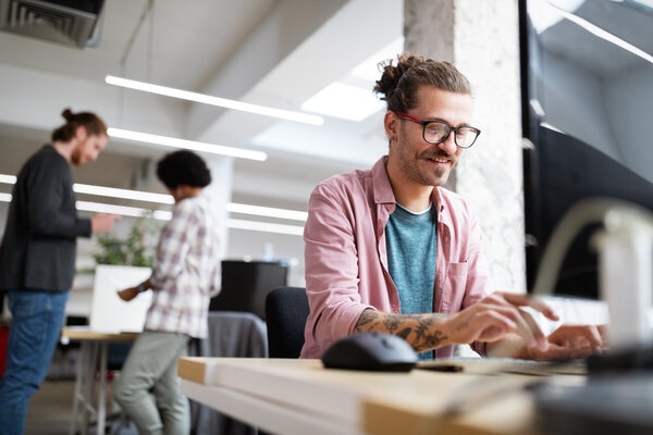 office colleagues working as a group with focus on young woman worker