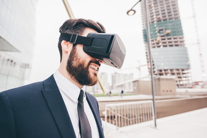 Businessman wearing VR goggles