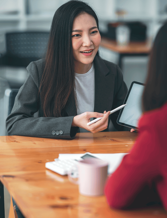woman pointing at tablet
